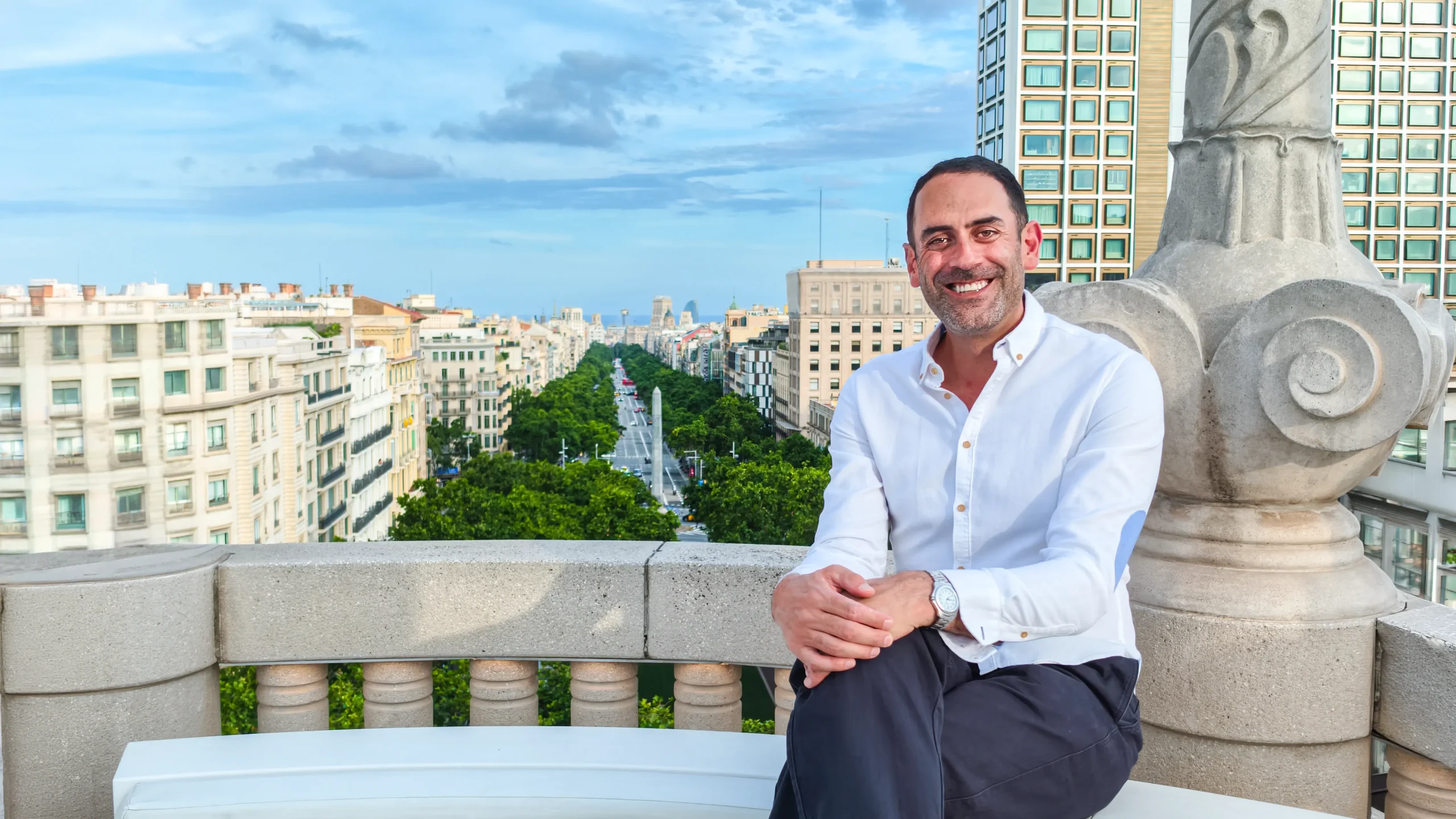 Benny James on a terrace overlooking Barcelona